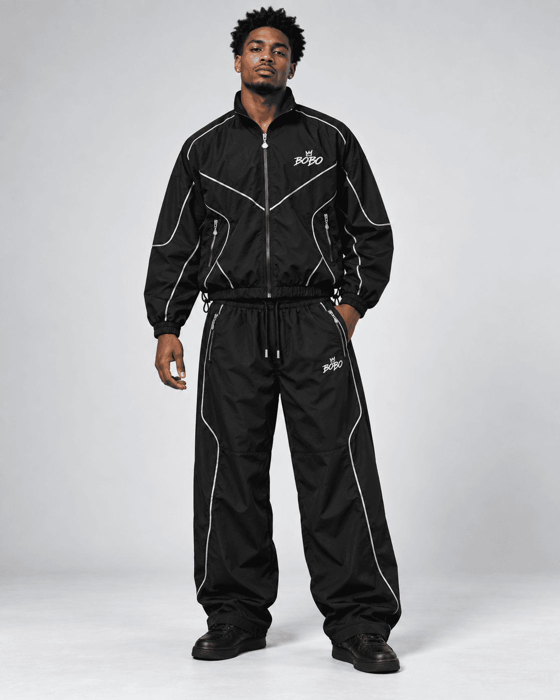 Model wearing the BOBO Reflective Tech Track Set, front view